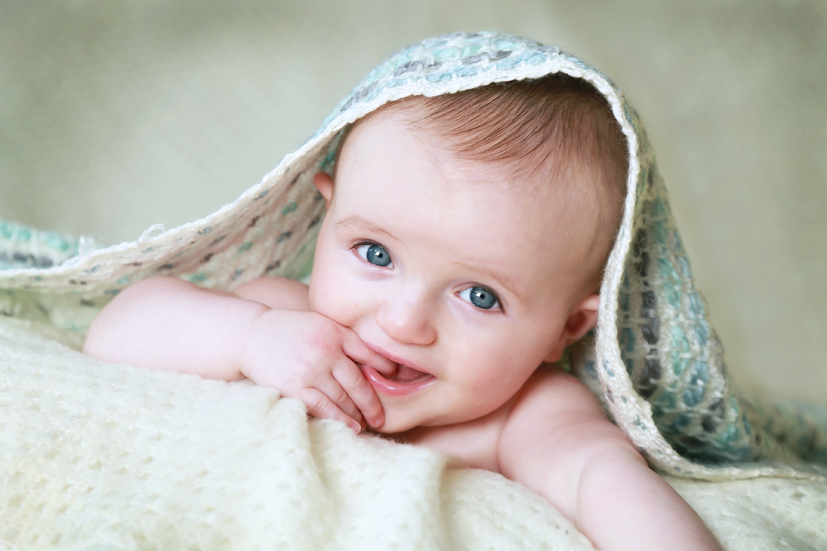 Photograph of a baby with blue eyes